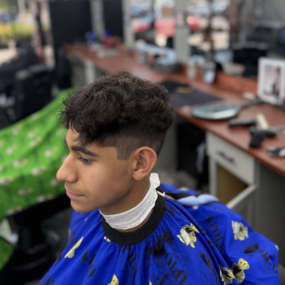 Curly top with a taper fade