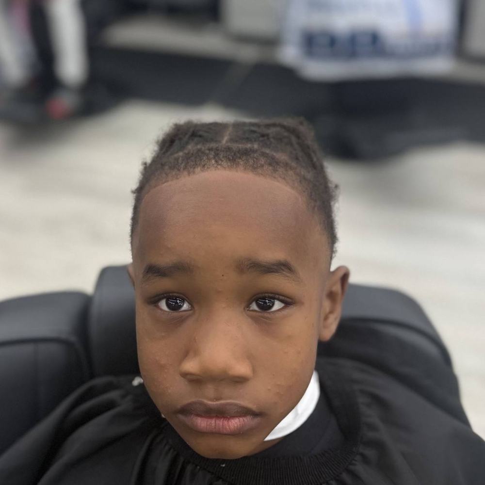 Young boy with a fresh line up and part design